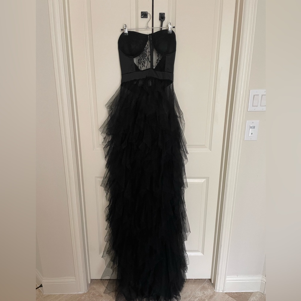 Strapless black tulle dress. Size Large. Sold with black slip skirt.